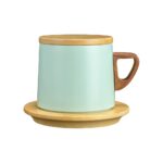 stainless steel cup with wooden mat